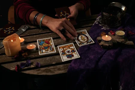 a tarot card reading at a table