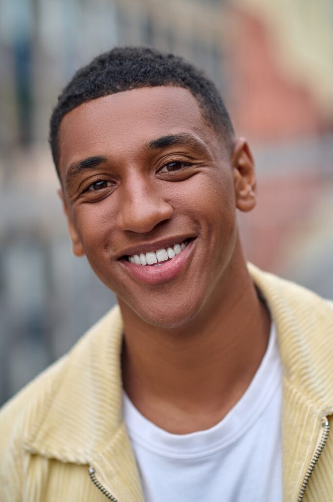 Headshot of a smiling handsome young man